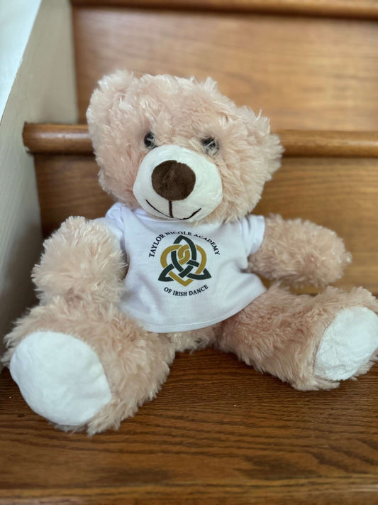 TNA Teddy BearTeddy BearTaylor Nicole Academy,Teddy Bear,TNAGet ready to cuddle up with our 18" TNA Teddy Bear! Made with super soft material, this adorable bear is the perfect companion for your dancer. Experience the joy and comfort of this high-quality