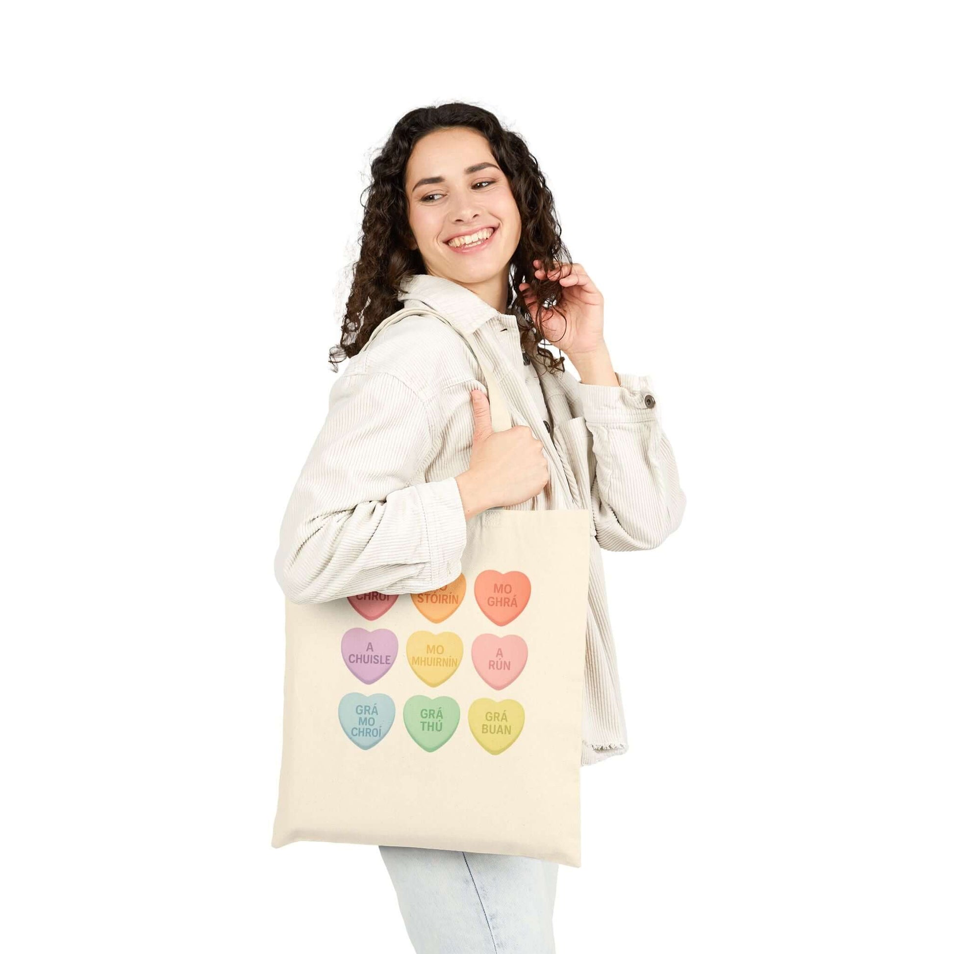 Gaelic conversation hearts tote bag on pink background

Irish love phrases canvas tote bag flat lay

Natural canvas tote with Gaelic Valentine hearts

Irish language tote bag with pastel hearts
