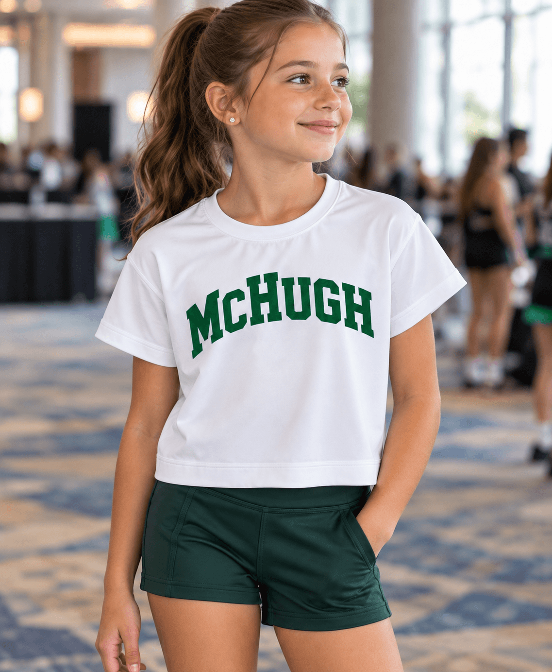 Irish dancer wearing the McHugh green varsity open-back crop tee