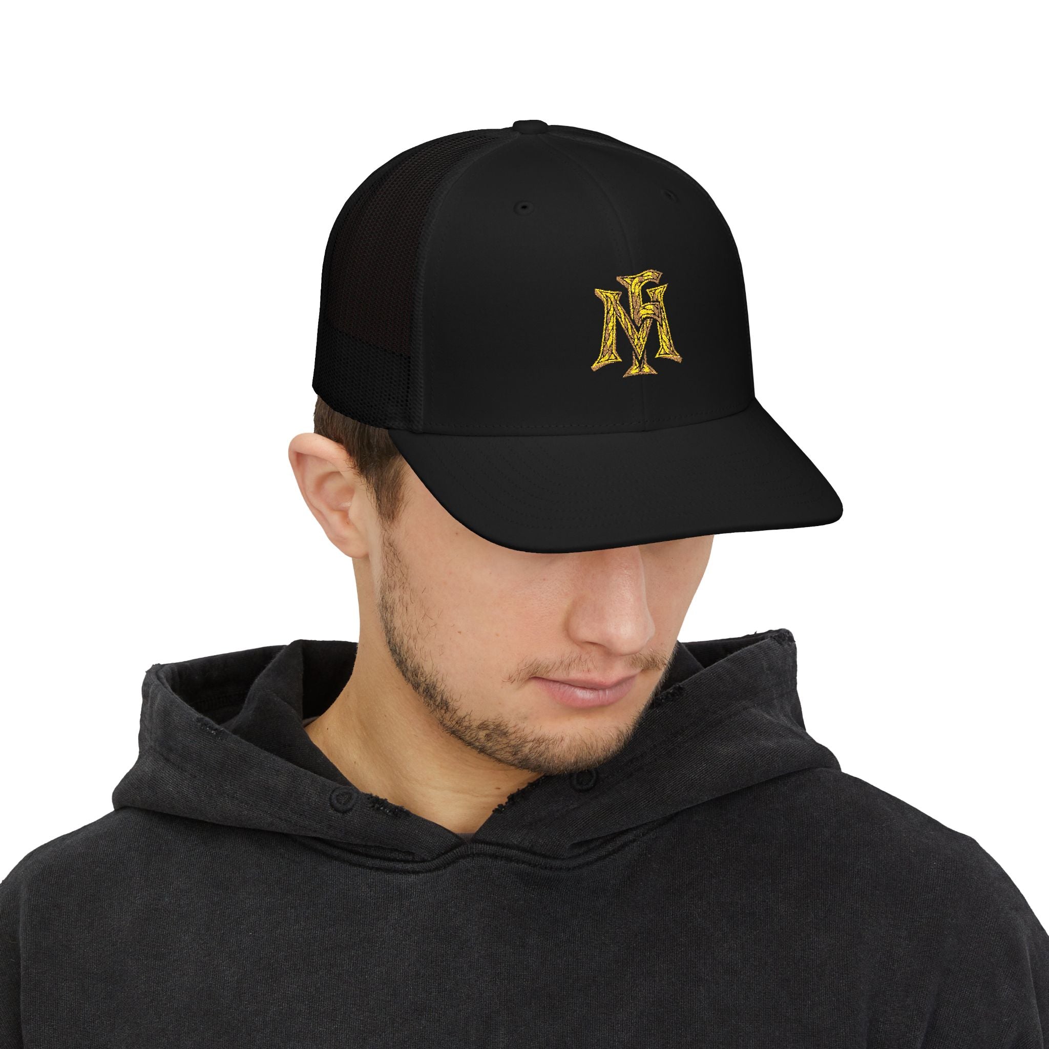 Man wearing a black cap with 'Montgomery Frank' logo on a white background