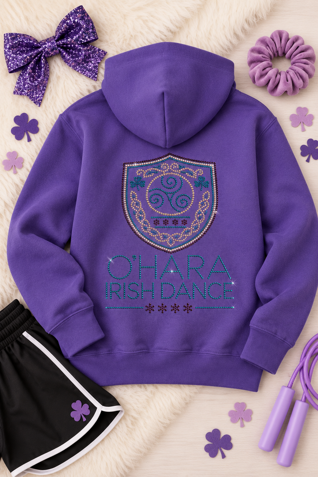 Back of the purple O'Hara youth zip hoodie showing the rhinestone O'Hara Irish Dance crest in purple, AB and aqua stones