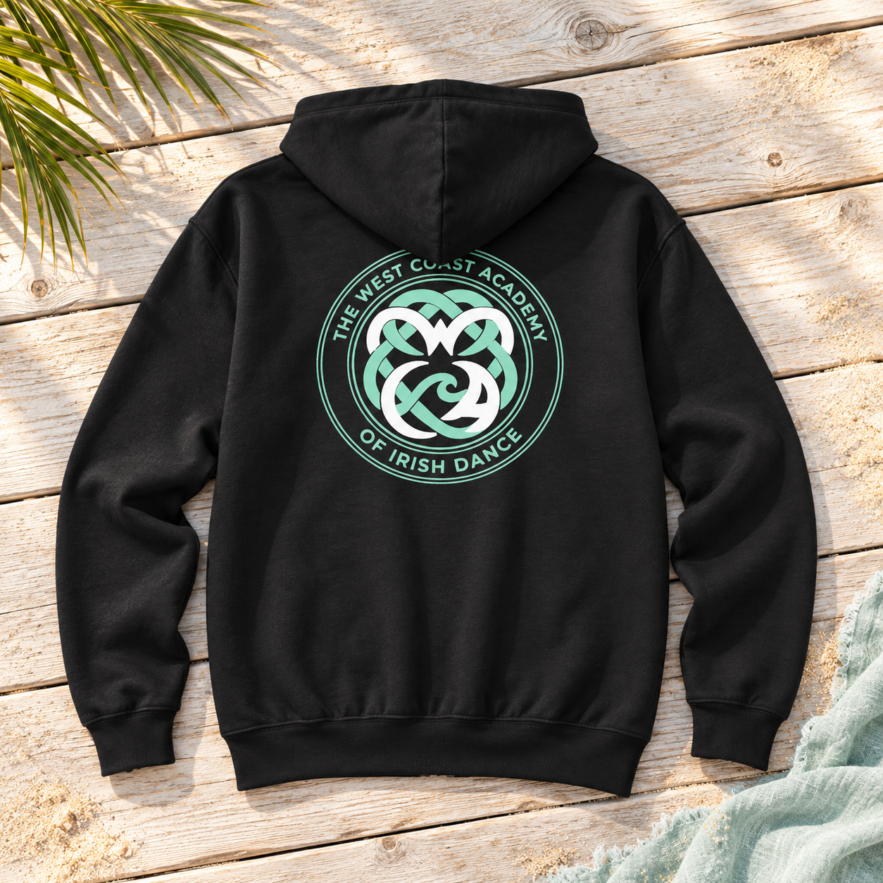 Black West Coast Academy Irish dance hoodie with teal school logo – matching family Irish dance gear