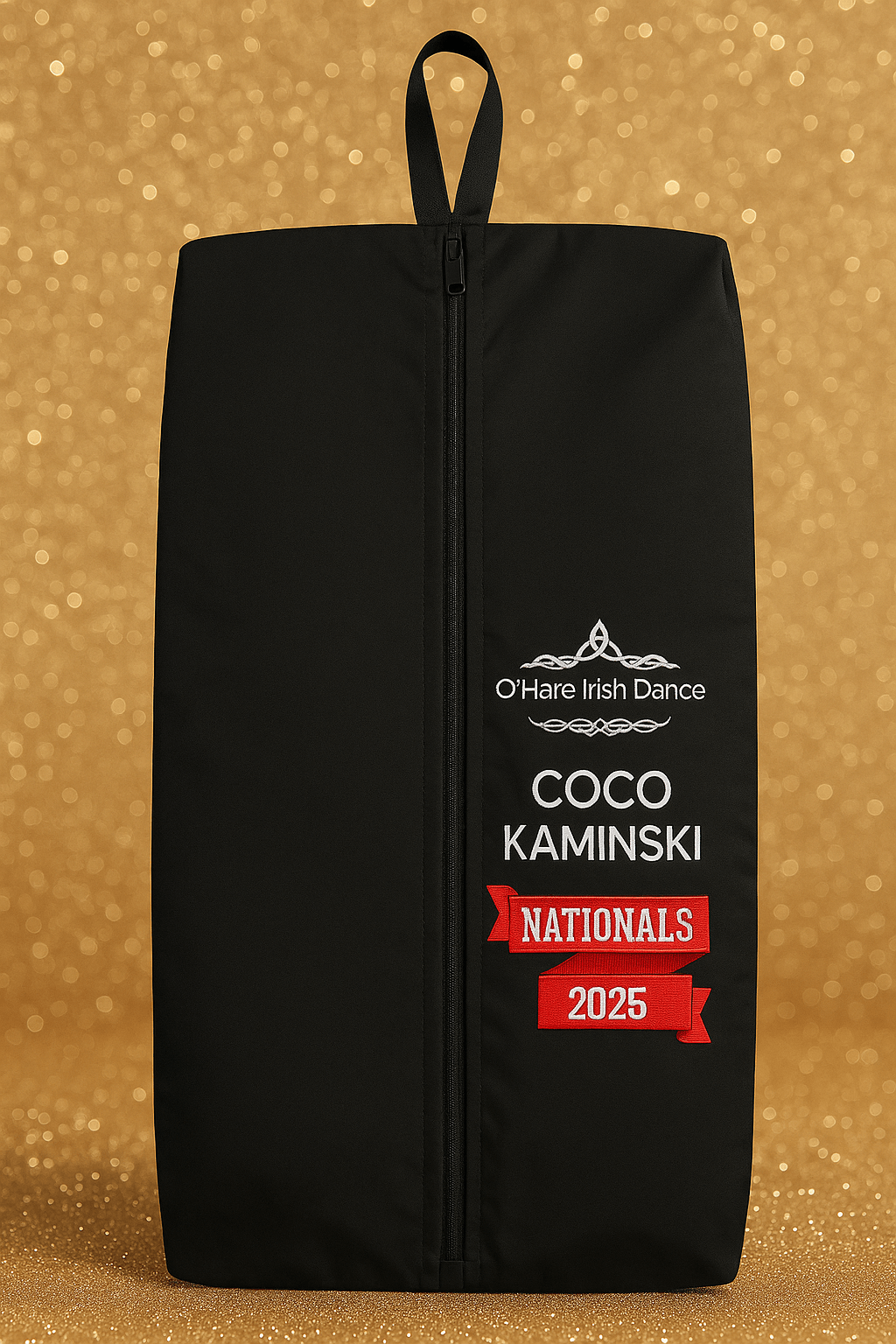 Black bag with white and red text on a gold glittery background